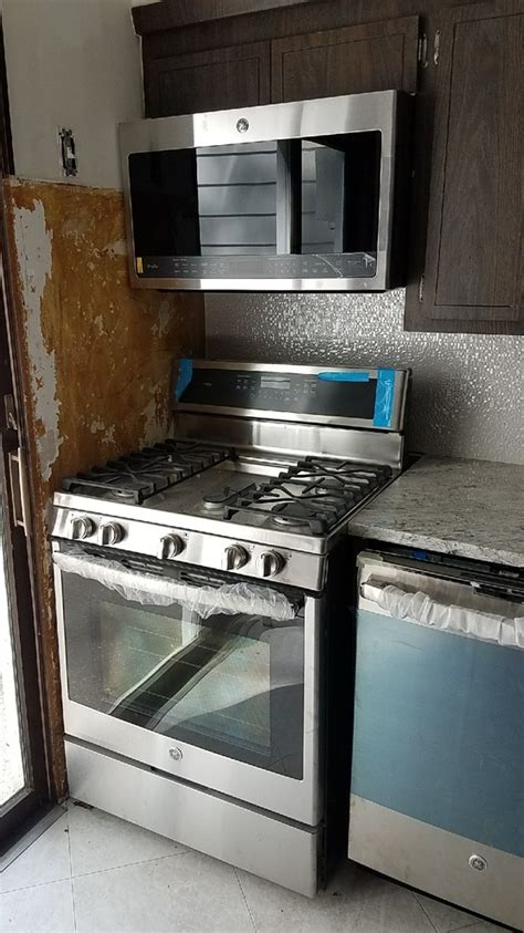 can you put a gas range next to a wall